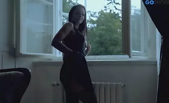 Enchanting Brunette in Black Dress and Tempting Stockings